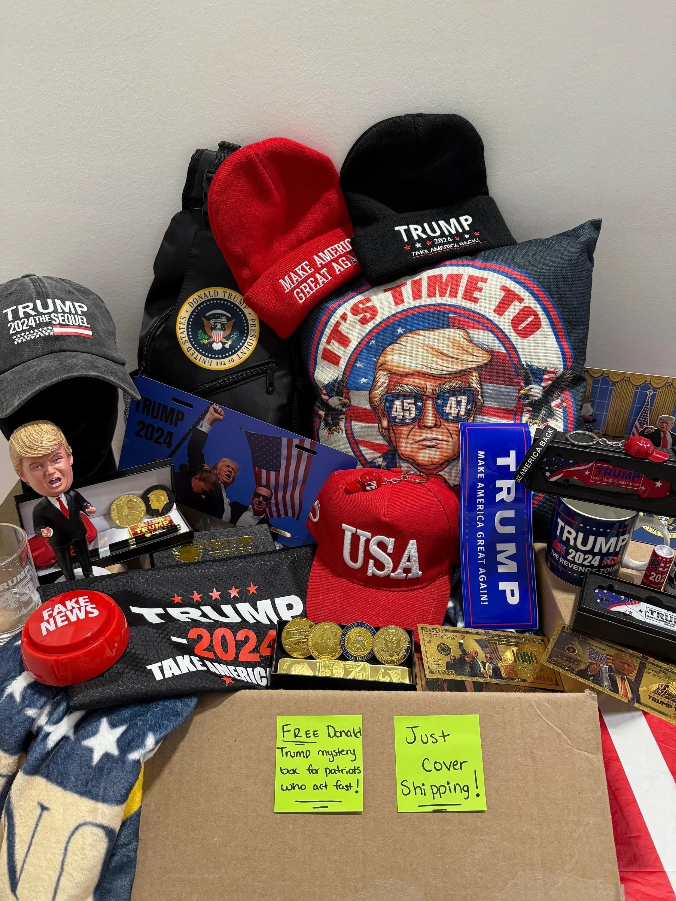 Mystery box contents: Trump hats, beanies, gold coins and bills, mugs, pillow, blanket and patriotic collectibles