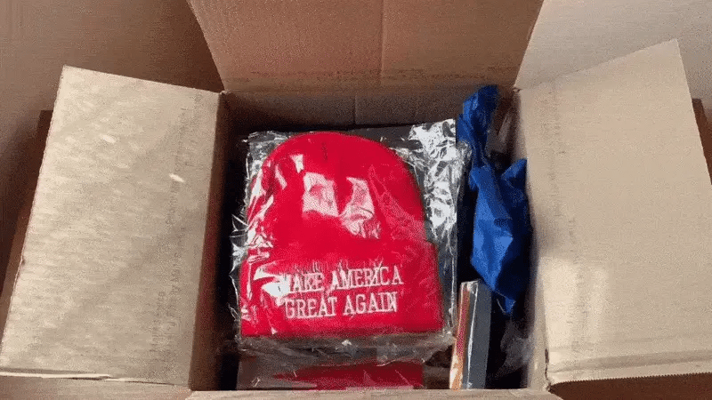 Opening a shipped mystery box full of MAGA gear